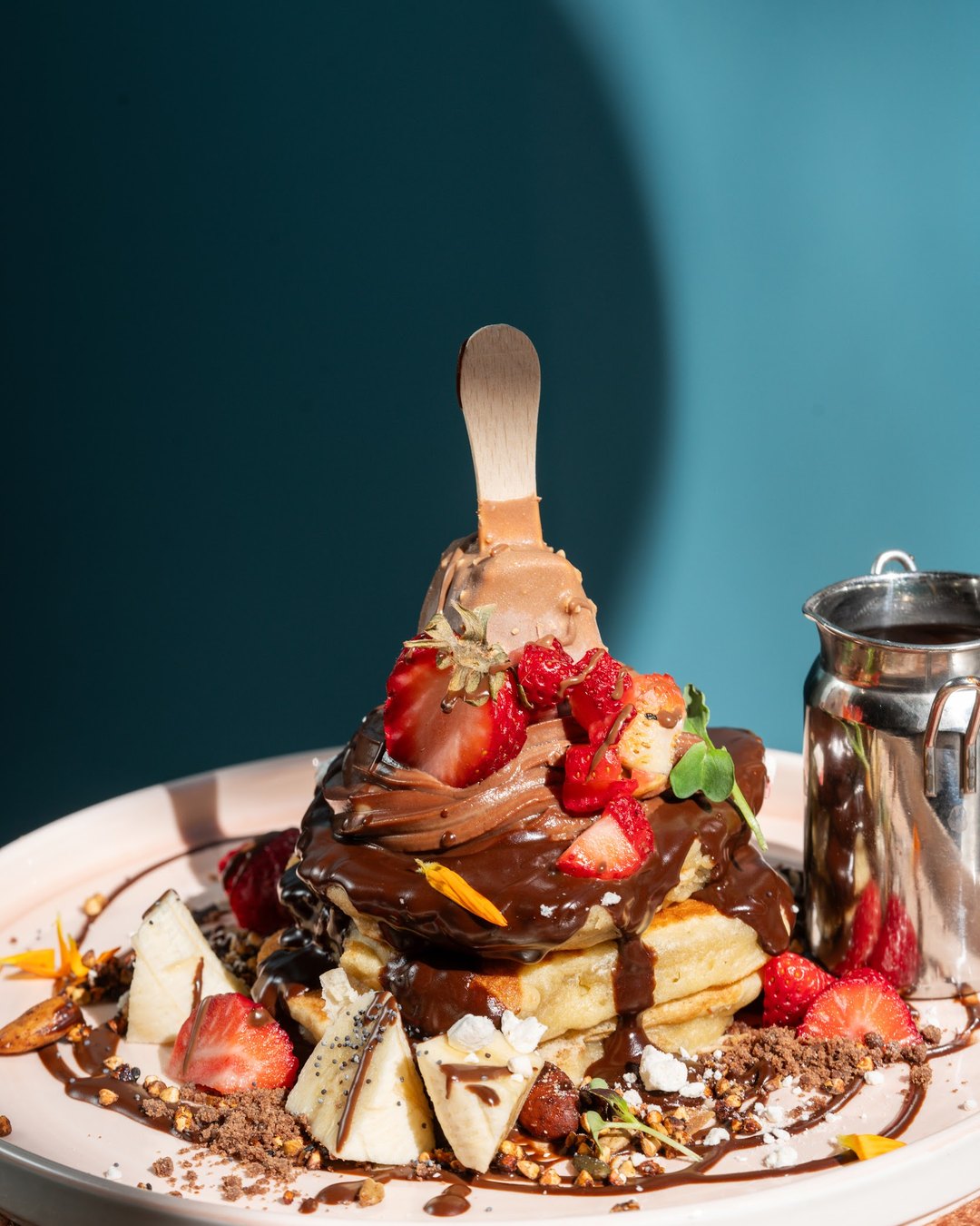 Berry pancakes on a bright table, a family-friendly brunch in Barcelona